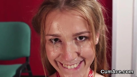 Peculiar looker gets sperm load on her face swallowing
