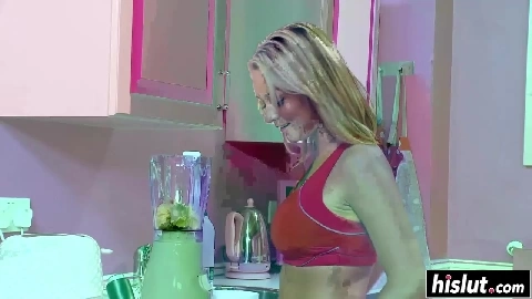 Tanned blonde sits on a large rod