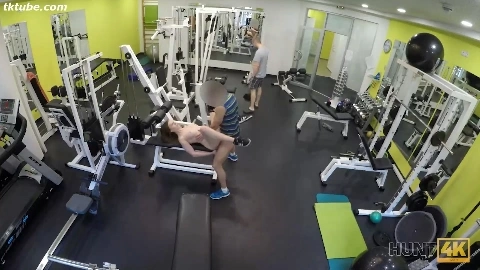 A girl has sex with a stranger in front of her boyfriend at the gym.